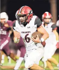  ?? David G. Whitham / For Hearst Connecticu­t Media ?? Cheshire running back Christian Russo breaks a long run for his first touchdown of the night against North Haven earlier this season at Vanacore Field in North Haven.