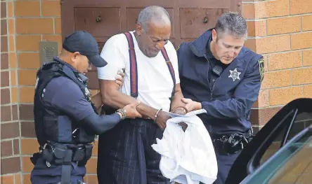  ?? JACQUELINE LARMA/AP ?? Bill Cosby is taken away in handcuffs after he was sentenced for felony sexual assault.