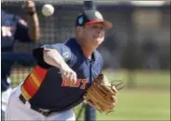  ?? JEFF ROBERSON — THE ASSOCIATED PRESS ?? In this file photo, Houston Astros pitcher Brad Peacock throws live batting practice during spring training baseball practice in West Palm Beach, Fla. Last spring Brad Peacock entered Astros camp worried that he wouldn’t make the team. After the best...