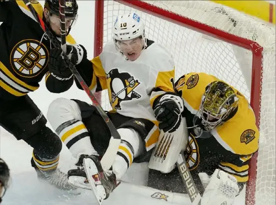  ?? Associated Press ?? Penguins winger Drew O’Connor crashes into Bruins goalie Jaroslav Halak, right, in the second period Thursday night in Boston.