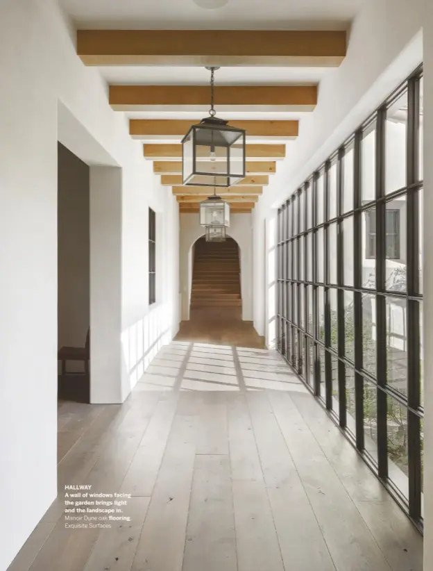  ??  ?? HALLWAY
A wall of windows facing the garden brings light and the landscape in.
Manoir Dune oak flooring, Exquisite Surfaces