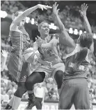  ?? Sean D. Elliot/The Day via AP, File ?? Connecticu­t Sun's Alyssa Thomas passes the ball between the defense of Seattle Storm's Breanna Stewart, left, and Crystal Langhorne during the second half of a WNBA basketball game June 29 in Uncasville, Conn.