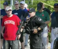  ?? AP PHOTO/CLIFF OWEN ?? A Capitol Hill Police officer stands watch in Alexandria, Va., Wednesday after a shooting involving House Majority Whip Steve Scalise of La., and others, during a Congressio­nal baseball practice.