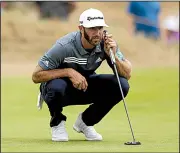  ?? AP/JON SUPER ?? Dustin Johnson lines up a putt on the third hole Thursday. Johnson carded a 5-over 76 after making a triple bogey on the 18th.