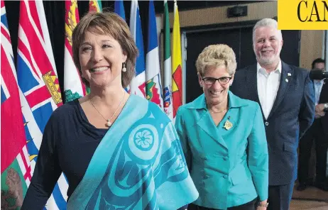  ?? JONATHAN HAYWARD / THE CANADIAN PRESS ?? British Columbia Premier Christy Clark, left, Ontario Premier Kathleen Wynne, and Quebec Premier Philippe Couillard announced Friday that they reached an agreement that will allow consumers to purchase wine online through each province’s...
