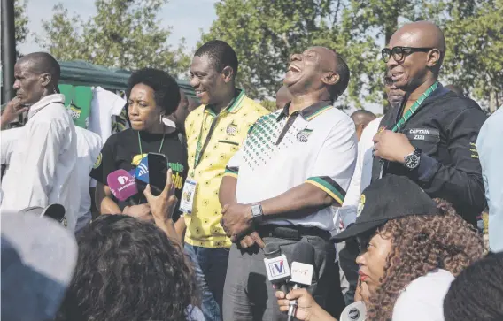  ?? Picture: Yeshiel Panchia ?? HAPPY DAY. Newly-elected ANC President Cyril Ramaphosa on a media walkabout, where he stopped to speak to stall owners about their businesses, at the party’s 54th national conference in Johannesbu­rg yesterday.