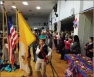  ??  ?? Mater Dei Catholic School students lead a procession of roughly 100 local veterans into a ceremony honoring the veterans for their service on Nov. 9.