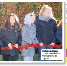  ??  ?? Helping hands Local schoolchil­dren with handmade poppies