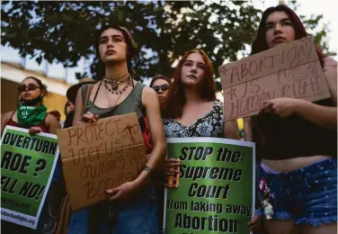  ?? Jae C. Hong / Associated Press ?? Women protest the ruling outside the federal courthouse in Los Angeles. Companies must decide whether and how to cover abortion access for workers in states where the procedure is now illegal or inaccessib­le.