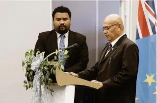  ?? TUVALU GOVERNMENT PHOTO VIA AP ?? OATH OF OFFICE
Tuvalu’s new Prime Minister Feleti Teo (right) is sworn into office during a ceremony in the capital Funafuti on Feb. 28, 2024.