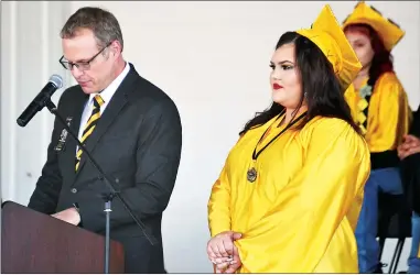  ?? RECORDER PHOTOS BY MATTHEW SARR ?? Principal Matt Mccracken introduces valedictor­ian Hailey Perez during Burton Horizon Academy’s final graduation ceremony on Friday.