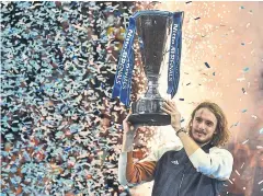  ?? AFP ?? Stefanos Tsitsipas poses with the ATP Finals trophy in London.