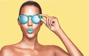  ?? SNAP ?? Snapchat Spectacles will be sold through yellow pop-up vending machines called Snapbots.