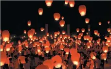  ?? HAO QUNYING / FOR CHINA DAILY LIU TAO / FOR CHINA DAILY Lanterns light up the sky ?? Students show their painted fans featuring the Jade Rabbit and the moon deity, two icons of Mid-Autumn Festival, in Handan, Hebei province. Center: during the festival in Yichun city, Jiangxi province. Right: The game of bobing is popular in Xiamen, Fujian province.