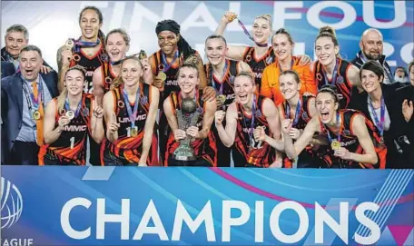  ?? BSR Agency/Getty Images ?? PLAYERS ON UMMC Ekaterinbu­rg, including Brittney Griner, top left, celebrate their EuroLeague title in Istanbul in April 2021.