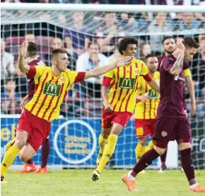  ??  ?? Silencing the crowd: Bubalovic (left) celebrates his damaging opener