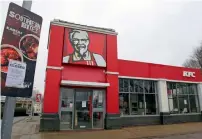  ?? AP ?? A closed sign is seen outside a KFC restaurant near Ashford, England, on Monday. —