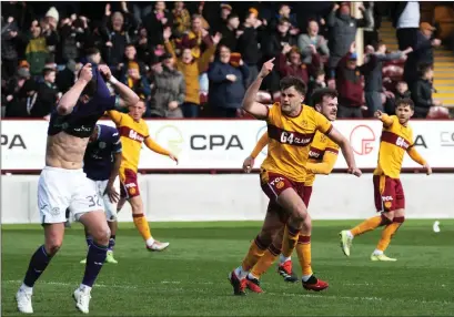  ?? ?? Motherwell’s Shane Blaney celebrates a 94th- minute goal which consigned Hibs to the bottom six on Saturday