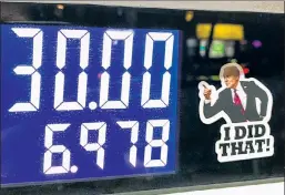  ?? ?? Sticker shock: Someone laid blame on Biden for high gas prices at an Astoria gas station — back in March, and pump prices have only risen since then.