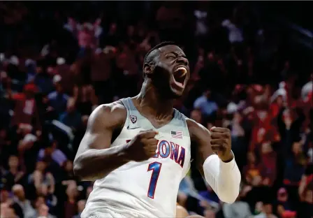  ?? ASSOCIATED PRESS ?? ARIZONA’S RAWLE ALKINS CELEBRATES AFTER DUNKING championsh­ip in Las Vegas. Arizona won 75-61. against Southern California during the second half of Saturday’s game for the Pac-12 men’s tournament