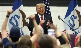  ?? CHARLIE NEIBERGALL — THE ASSOCIATED PRESS ?? Former President Donald Trump reacts as he visits with campaign volunteers at the Grimes Community Complex Park on Thursday in Des Moines, Iowa.