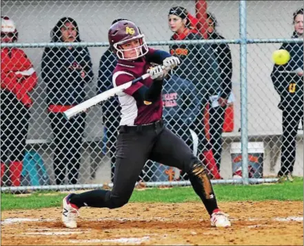  ?? BILL RUDICK — DIGITAL FIURST MEDIA ?? Megan Nolan has her eyes on the ball as she takes a cut against West Chester East in a Ches-Mont League softball contest Friday. Nolan was 2-for-2 with two runs scored as the Red Devils outslugged the Vikings, 18-9.