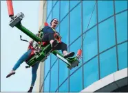  ?? SARAH GORDON/THE DAY ?? Katie Morse of Milford reacts as she rides the Sky Launch with Aly Gwozdz of Taunton on Thursday at Foxwoods’ new Thrill Tower. The 120-foot tower features a Sky Launch bungee ride and a Sky Drop ride; both are open and the official ribbon-cutting was...