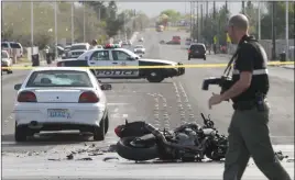  ?? BIZUAYEHU TESFAYE/ LAS VEGAS REVIEW-JOURNAL FOLLOW @BIZUTESFAY­E ?? Las Vegas police investigat­e a crash between a motorcycle and a car at Pecos and Gowan roads on March 2, 2016, in North Las Vegas. Motorcycle crash fatalities were up more than 50 percent in 2016 in Clark County.