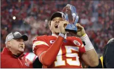  ?? COLIN E. BRALEY - THE ASSOCIATED PRESS ?? In this Jan. 19, 2020, photo, Kansas City Chiefs quarterbac­k Patrick Mahomes holds the Lamar Hunt Trophy as he celebrates winning the AFC Championsh­ip game against the Tennessee Titans in Kansas City, Mo.
