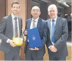  ??  ?? John Alexander with COES vice-president Jiang Yan and Callum Facolner, chief executive of DundeeCom.