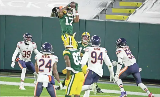  ?? ASSOCIATED PRESS ?? Packers receiver Davante Adams catches one of his 20 touchdown passes, including two touchdowns in the post-season. He caught 133 passes for 1,507 yards overall.