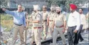  ??  ?? Jalandhar divisional commission­er B Purusharth­a (left) with cops inspecting the accident site in Amritsar on Thursday. HT PHOTO