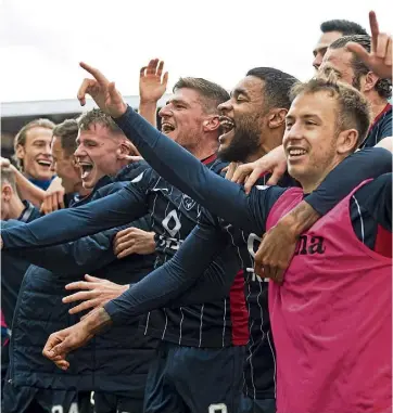  ?? ?? JUBILATION: Ross County celebrate their late victory over Aberdeen in April 2022.