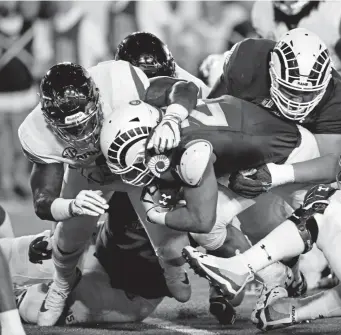  ?? Hyoung Chang, The Denver Post ?? Colorado State running back Izzy Matthews scores winning touchdown against Arkansas at Canvas Stadium. CSU won 3427.