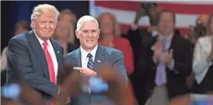  ?? EVAN VUCCI, AP ?? Donald Trump and Mike Pence appear Monday in Roanoke, Va.