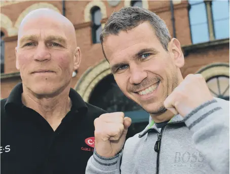  ??  ?? As strong a relationsh­ip as you will ever see in boxing, Martin Ward (right) with trainer Neil Fannan. Picture: Stu Norton.