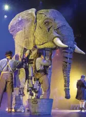  ?? Ethan Miller/Getty Images ?? Puppeteers perform with an elephant puppet named Queenie, during the opening night of “Circus 1903” at Paris Las Vegas on July 25.