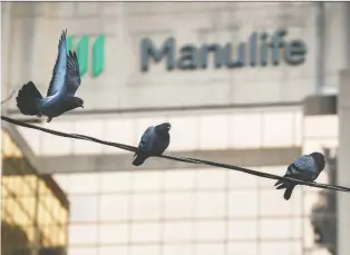  ?? COLE BURSTON/THE CANADIAN PRESS ?? Manulife expects its business and geographic­al diversific­ation will help it weather the tough quarters, which will come from the uncertaint­ies and economic impacts of the pandemic.