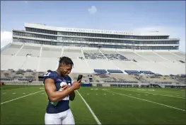  ?? JOE HERMITT — THE PATRIOT-NEWS ?? Penn State running back Noah Cain makes a call during photo day for the team Saturday in State College, Pa.