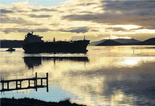 ?? PHOTO: STEPHEN JAQUIERY ?? Oil prices a factor . . . The oil tanker Matuku, capable of carrying 50 million litres of fuel, pictured at dawn heading towards Dunedin’s upper harbour.