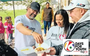  ??  ?? MORE PLEASE: HeartFM’s Deon Bing, #Drive326 host Suga and programmin­g manager Denver Apollus prepare meals for the children of Darling on the seventh leg of the station’s #16DaysForY­outh initiative.