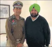  ?? HT PHOTO ?? New DGP Dinkar Gupta with chief minister Amarinder Singh after taking charge in Chandigarh on Thursday.