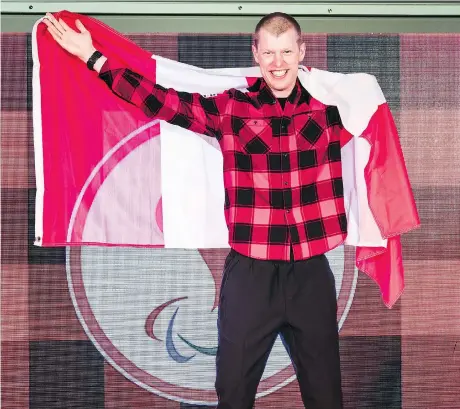  ?? DAVE HOLLAND ?? Mark Arendz, who won six medals in biathlon and cross-country skiing, was Canada’s flag-bearer for the closing ceremonies at the 2018 Paralympic Winter Games in Pyeongchan­g, South Korea, on Sunday. Canada amassed 28 medals overall, surpassing a...