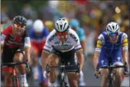  ?? PETER DEJONG — ASSOCIATED PRESS ?? Peter Sagan of Slovakia, center, crosses the finish line ahead of Ireland’s Daniel Martin, right, and Belgium’s Greg van Avermaet, left, to win the third stage of the Tour de France cycling race over 212.5 kilometers (132 miles) with start in Verviers,...