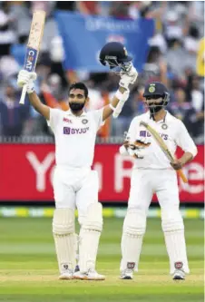  ?? (Photo: AFP) ?? India’s Ajinkya Rahane (left) celebrates scoring his century (100 runs) as teammate Ravi Jadeja looks on during the second day of the second cricket Test match between Australia and India at the MCG in Melbourne on Sunday.