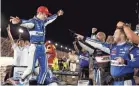  ?? JEFF ROBERSON/AP ?? Takuma Sato celebrates with his crew after earning his fifth NTT IndyCar Series win.