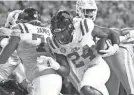  ?? BRIANNA PACIORKA/NEWS SENTINEL ?? Mississipp­i RB Snoop Conner (24) scores a touchdown against Tennessee at Neyland Stadium on Oct. 16.