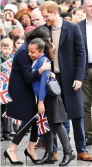  ??  ?? Cuddle time: Sophia Richards gets hug from Meghan Markle