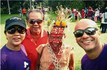  ??  ?? Sharing happiness: (From left) Engineer Raja Fernaliz Raja Harris with her father Raja Harris Raja Hasbullah, village elder Bah Deh and husband Wan Irfan Rinezry at last year’s FreeMarket event.