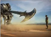  ?? PARAMOUNT PICTURES ?? Megatron and Josh Duhamel as Lennox are shown in a scene from “Transforme­rs: The Last Knight.” The fifth installmen­t of the series had a weak box-office debut in the United States, but still opened at No. 1.